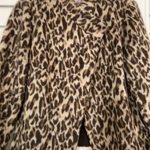 Chico jacket. One botton … hidden across chest.